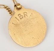 An Italian 18ct gold "LIBRA" zodiac pendant on an 18ct gold chain (A/F), 20th century, 37.5 grams total. - 2
