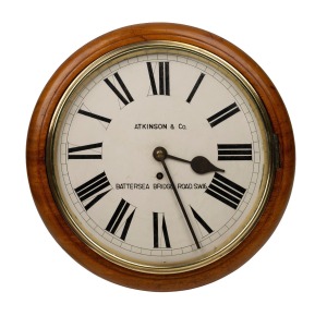 An antique English dial clock in mahogany case, with eight day fusee movement, 12" dial with Roman numerals, minute track and spade hands, signed "Atkinson & Co. Battersea Bridge Road, S.W.16", circa 1900, 38cm diameter.