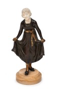 DOMINIQUE ALONZO (active 1910-1930) "The Curtsy" Art Nouveau patinated bronze statue with finely carved ivory head, on onyx base, stamped "ALONZO, ETLING, PARIS", 21cm high overall.