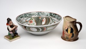 An antique Staffordshire pottery figure, a Royal Doulton "Dickens" jug, and a pottery fruit bowl by Alan Caiger-Smith for Aldermaston Pottery, 19th/20th century, (3 items), the statue 15cm high.