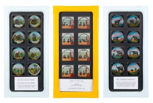 Three sets of eight glass slides for magic lantern, comprising "The Elephant's Revenge", "A Child and Two Lovers", and "The Tiger and the Barrel"; each set housed in its own framed display with glass backing, 53.5 x 26cm overall.