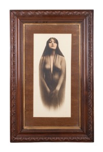 Hand-coloured photograph of a young woman in a sheer veil; popular speculation over the years has identified the subject as Josephine Earp (wife of Wyatt Earp), but this remains in dispute; framed and glazed, 83 x 52cm overall.