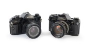 CANON: Pair of 1970s black-body SLRs, comprising Canon A-1 (Zoom FD 35-70mm f3.5-4.5) and Canon AE-1 (FD SSC 50mm f1.4).