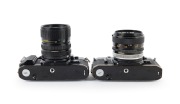 CANON: Pair of 1970s black-body SLRs, comprising Canon A-1 (Zoom FD 35-70mm f3.5-4.5) and Canon AE-1 (FD SSC 50mm f1.4). - 3
