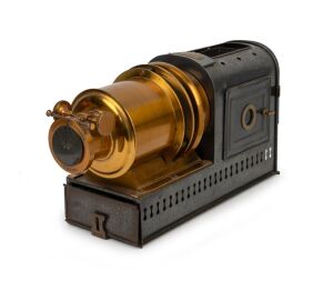 NEGRETTI & ZAMBRA: Circa 1900s magic lantern, black-lacquered tin body, dual side-opening doors with blue glass peepholes; dimensions 22 x 13.5 x 40cm.