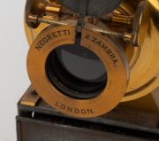 NEGRETTI & ZAMBRA: Circa 1900s magic lantern, black-lacquered tin body, dual side-opening doors with blue glass peepholes; dimensions 22 x 13.5 x 40cm. - 3