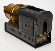 NEGRETTI & ZAMBRA: Circa 1900s magic lantern, black-lacquered tin body, dual side-opening doors with blue glass peepholes; dimensions 22 x 13.5 x 40cm. - 4