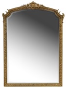 A Louis XV style gilt plaster and hardwood mantle mirror with shell bead and floral decoration, an impressive 190cm x 138cm overall.