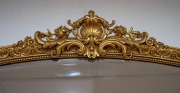 A Louis XV style gilt plaster and hardwood mantle mirror with shell bead and floral decoration, an impressive 190cm x 138cm overall. - 2