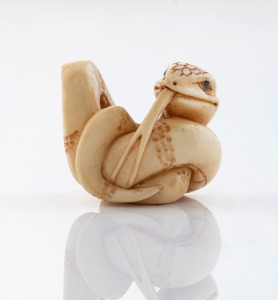 A Japanese carved ivory serpent netsuke, signed on the reverse, 19th/20th century, 2.5cm high, 3cm wide.