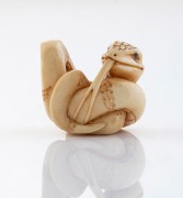A Japanese carved ivory serpent netsuke, signed on the reverse, 19th/20th century, ​​​​​​​2.5cm high, 3cm wide.