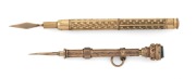 An antique 9ct gold retractable toothpick with goldstone top (stamped 9ct), together with an antique gold plated retractable toothpick, 19th/20th century, (2 items), 6cm and 7cm long.