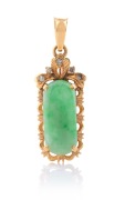 An 18ct gold, jade and diamond pendant, stamped "750", 3.7cm high, 3.6 grams total.