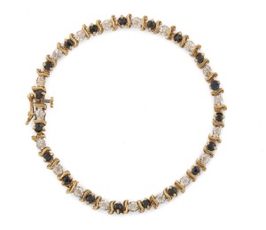 A 14ct gold, diamond and sapphire tennis bracelet, 20th century, 18cm long, 6.8 grams total.