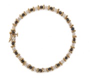 A 14ct gold, diamond and sapphire tennis bracelet, 20th century, ​​​​​​​18cm long, 6.8 grams total.