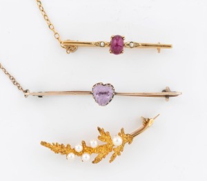 An antique 9ct gold bar brooch with cabochon ruby flanked by seed pearls; together with an antique 9ct rose gold bar brooch with heart shaped amethyst and a vintage 9ct gold fern leaf pearl brooch, early to mid 20th century, (3 items), the largest 5cm wide, 8 grams total.