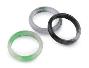 Three vintage Chinese jade bangles, 20th century, the largest internal size 5.5cm diameter.
