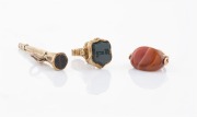 Antique pocket watch key, carnelian swivel fob and seal top fob, 19th century, (3 items), ​​​​​​​the largest 3.5cm long.