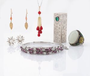 Sterling silver chain, Chinese silver, enamel and mutton jade ring, sterling silver and pearl screw-back earrings, 15ct gold and coral earrings, a gilt metal and coral pendant, a Continental silver ladies lipstick compact with greenstone clasp and an impressive white metal bangle set with red and white stones, (7 items).