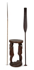 Dyak tribal paddle with attractive carved decoration; together with a Papua New Guinea carved wood figural stool (A/F) and a Papua New Guinea arrow, (3 items), the largest 129cm long.