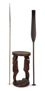 Dyak tribal paddle with attractive carved decoration; together with a Papua New Guinea carved wood figural stool (A/F) and a Papua New Guinea arrow, (3 items), the largest 129cm long.