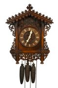 An antique German Black Forest cuckoo and quail wall clock, attributed to JOHANN BAPTIST BEHA, 30-hour duration wood plate movement, carved walnut station house style case with decorative pierced scroll leaf and vine decoration, bone hands and applied Rom