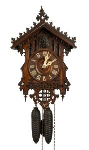 An antique German Black Forest cuckoo wall clock by JOHANN BAPTIST BEHA, model 361, with wood plate movement, carved and fretted Gothic influence lindenwood case with carved bone hands and Roman numerals, circa 1860, the case 43cm high, 27cm wide.