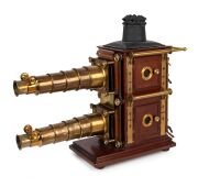 BIUNIAL MAGIC LANTERN: Large c. 1880s mahogany and brass example with impressive quadruple-extension lens barrels, tin chimney element, limelight burner apparatus, four side-opening doors with red or blue peepholes, together with two condenser lenses and - 2
