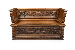 An antique Florentine carved walnut casapanca, 18th century, 101cm High, 172cm wide, 54cm deep.