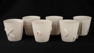ARTIST UNKNOWN set of six fine Australian porcelain beakers, ​​​​​​​8.5cm high.