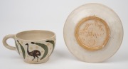 REYNELLA POTTERY teacup and saucer with hand-painted emu and gumleaf decoration, (2 items), incised "REYNELLA POTTERY S. AUS. 1921", ​​​​​​​the saucer 13cm diameter. - 3