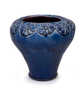 ARTIST UNKNOWN blue glazed pottery vase with red interior and sgraffito floret motif, incised signature to base obscured by glaze, ​​​​​​​12cm high.
