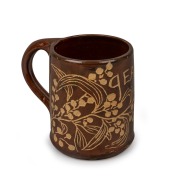 REYNELLA POTTERY brown glazed mug with sgraffito wattle decoration, named to "GEAN", incised "REYNELLA POTTERY S. AUS. 1921", 9cm high.