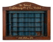 "THE FEDERAL CONFECTIONARY CO. OF TAS. LTD. 86 Collins St." antique Australian cedar point of sale confectionary wall mount display with tin insert, 19th/20th century, 42cm high, 67cm wide, 6cm deep.
