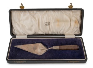 An antique Australian silver and blackwood presentation trowel, engraved "Presented To H. J. Bulgin Esq. To Set The Foundation Stone Of The Warringah Bowling Club Ltd. 23.7.27", manufactured by Fairfax & Roberts of Sydney and housed in original plush fitt
