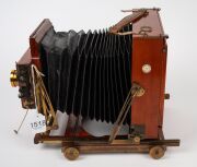 THORNTON-PICKARD: "Special Ruby" view camera [#530047], late-19th century, plate dimensions 12 x 16.5cm, twin Thornton-Pickard Beck Symmetrical lenses, Thornton-Pickard stereo roller-blind shutter, "Baker & Rouse" retailer's inlay. - 5