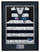 GEELONG SEASON 2005: Display incorporating a Cats guernsey with no fewer than thirty-eight signatures, including those of Gary Ablett Jr., Joel Corey, Henry Playfair, Tim Callan, and more; framed and glazed, 102 x 76cm overall.