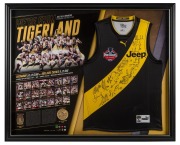RICHMOND 2017 PREMIERSHIP: "We're From Tigerland" guernsey and replica medal display, signed by all 22 Premiership players as well as coach Damien Hardwick; limited edition #218/1000 with CoA; attractively framed and glazed, 87 x 107cm overall.