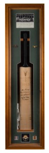 AUSTRALIAN SERVICES XI: 2001 full-size signed commemorative cricket bat with display incorporating team photograph and Australian military iconography; signatories comprise Stan Sismey, Ross Stanford, Colin Bremner, Reginald Ellis, and L.W. Maddison; limited edition #13/100 with CoA and cotton handling gloves; case dimensions 121 x 31 x 11cm.