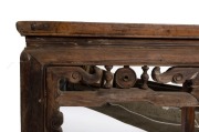 An antique Chinese elm centre table of mitred joint construction, panelled top and scroll frieze with turned decoration, 19th century, 80cm high, 92cm wide, 92cm deep. - 2