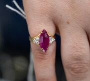 An 18ct gold ruby and diamond ring, stamped "18K", 4.2 grams total. - 2