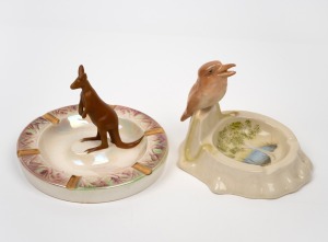 WEMBLEY WARE ceramic kookaburra ashtray with hand-painted billabong scene, together with a WEMBLEY WARE kangaroo ashtray, (2 items), ​​​​​​​11.5cm high.