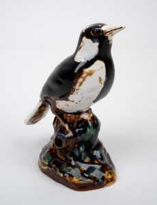 HUNTLY pottery magpie statue, factory mark to base, ​​​​​​​17.5cm high.
