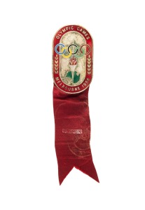 OFFICIAL BADGE - COMPETITORS: Manufactured by K.G. Luke, Melbourne; red enamelled border, silver background, dark red ribbon by Raleigh Print marked "GYMNASTICS"; numbered "6512" on reverse.