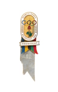 HIGH OFFICIAL BADGE - N.O.C. PRESIDENT: Manufactured by K.G. Luke, Melbourne; white enamelled border, gilt background, additional white enamelled bar marked "PRESIDENT" on ribbon in Olympic colours, lower pale blue ribbon marked "N.O.C."; numbered "79" on reverse.