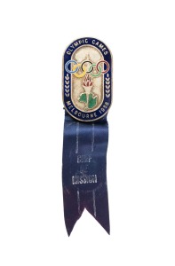 OFFICIAL BADGE - SPORTS & TEAM OFFICIALS: Manufactured by K.G. Luke, Melbourne; dark blue enamelled border, silver background, dark blue ribbon marked "CHEF DE MISSION"; numbered "849" on reverse.