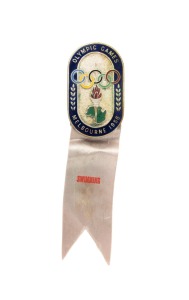 OFFICIAL BADGE - SPORTS & TEAM OFFICIALS: Manufactured by K.G. Luke, Melbourne; dark blue enamelled border, silver background, grey ribbon by Raleigh Print, marked "SWIMMING"; numbered "3434" on reverse.