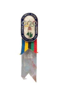 OFFICIAL BADGE - SPORTS & TEAM OFFICIALS: Manufactured by K.G. Luke, Melbourne; dark blue enamelled border, silver background, upper ribbon in Olympic colours, lower pale blue ribbon marked "N.O.C."; numbered "370" on reverse.
