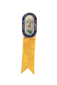 OFFICIAL BADGE - SPORTS & TEAM OFFICIALS: Manufactured by K.G. Luke, Melbourne; dark blue enamelled border, silver background, yellow ribbon marked "BOXING"; numbered "2296" on reverse, together with armband marked "XVIth OLYMPIAD - JUDGE - BOXING". (2 items)