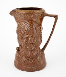 163 · A 1977 Centenary Test commemorative jug depicting Greg Chappell and Tony Greig (the opposing captains) from a limited edition by Bendigo Pottery; numbered 660, 17cm high.